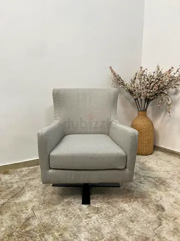 Upholstered swivel arm chair