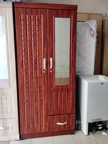 Two-door wooden wardrobe with mirror and drawer — good condition