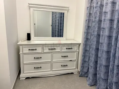 White wooden king bedroom set with vanity