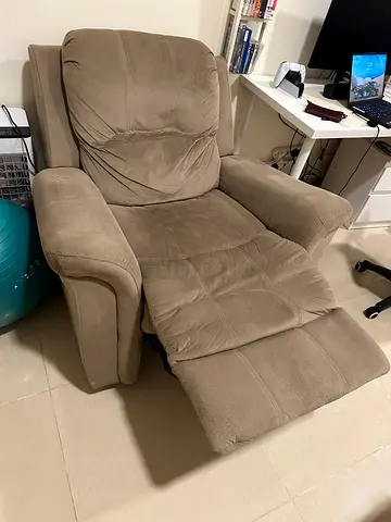 Comfortable single-seater beige recliner armchair - good condition