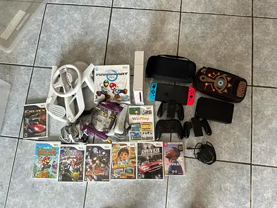 Nintendo Switch console with accessories and Wii with games bundle