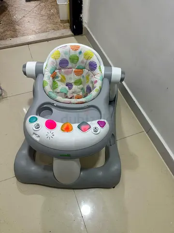 Baby walker with removable toy tray and padded seat