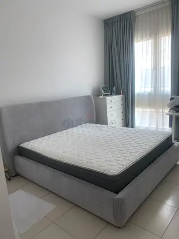 Grey fabric double bed frame with mattress and hydraulic storage good condition