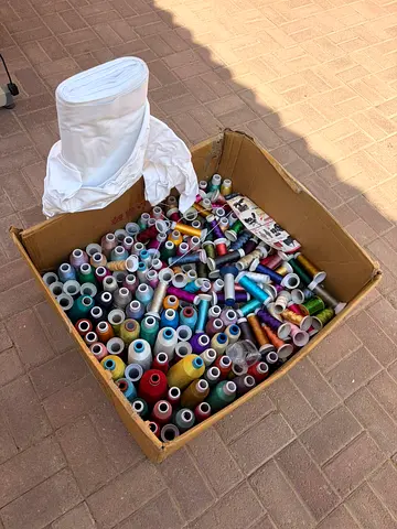 Large Box of Mixed Sewing Thread Cones and Fabric Roll - Assorted Colors