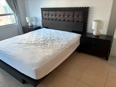 Queen bed frame with mattress and matching nightstands - dark wood