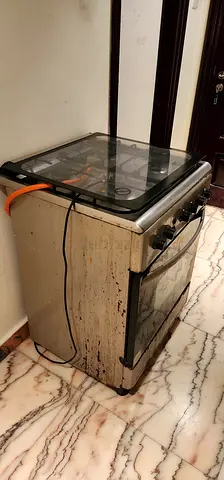 Give away price for Used freestanding gas oven with glass top - needs cleaning