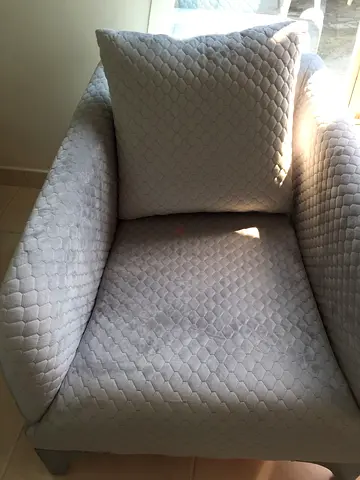 Light grey quilted single armchair with cushion