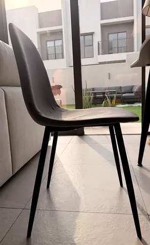 Set of 6 Grey Fabric Dining Chairs with Black Metal Legs - AED 200