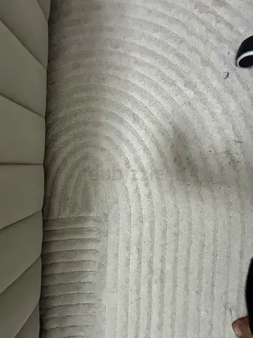 Light grey modern textured rug — good condition