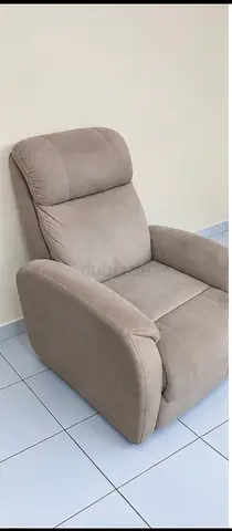 Comfortable beige single recliner armchair - good condition