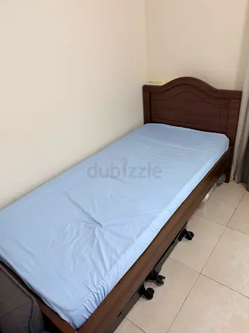 Wooden single bed frame with mattress