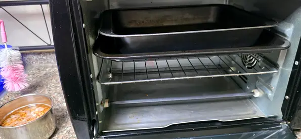 Used countertop toaster oven with trays and rack - good condition