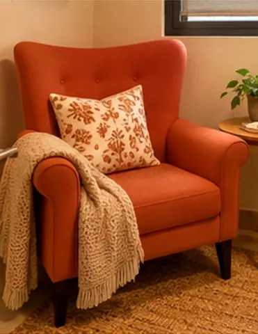 Comfortable single upholstered armchair in terracotta