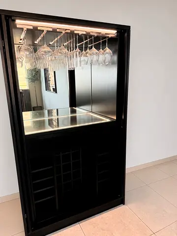Bespoke bar cabinet in dark wood-grain finish