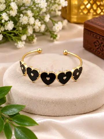 Gold-tone Cuff Bracelet with Black Heart Stones — Like New