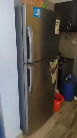 Super general Good condition two-door refrigerator - 2 years old, stainless steel finish