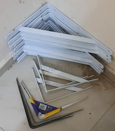 Used metal shelf brackets and triangular support braces - set of mixed sizes. Around 20 pieces.