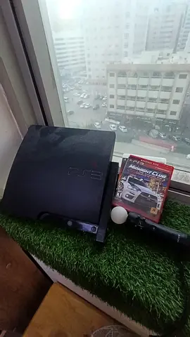 Sony PlayStation 3 Slim with Move controler and one normal controller and one free game