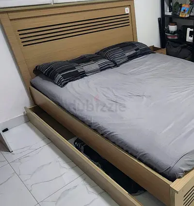 Queen wooden storage bed with headboard and under-bed drawer.