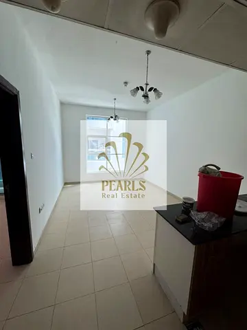 One-bedroom apartment with a living room for annual rent in City Tower, Al Nuaimiya 3, Ajman. The unit features a balcony and two bathrooms. Offered a