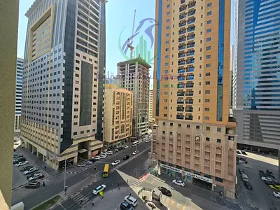 2-bedroom apartment in Al Taawun, Sharjah, with a maid’s room or storage space, open-view balcony, built-in wardrobes, and 4 or 6 instalments.