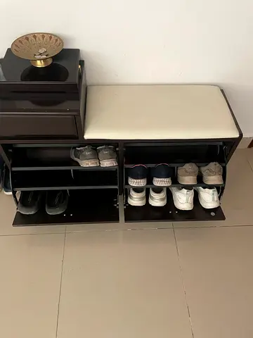 Dark wood shoe storage bench with cushioned seat - compact entryway organizer