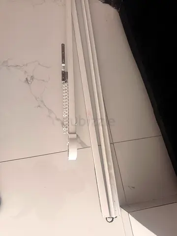 Somfy motors. White ceiling-mounted curtain track with gliders — good condition
