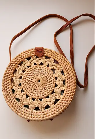 Round rattan woven crossbody bag with leather strap — light tan