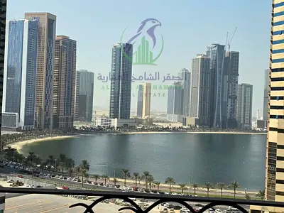 Spacious 3-bedroom apartment in Al Taawun, Sharjah, with a maid’s room, laundry room, two balconies, sea view, and free facilities.