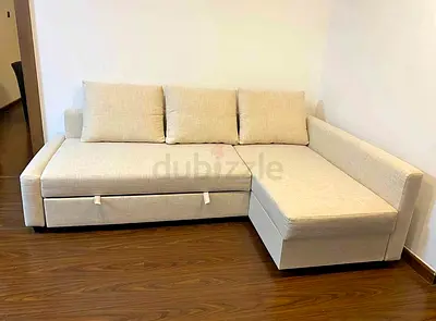 Beige L-shaped Sofa Bed with Storage - Good Condition