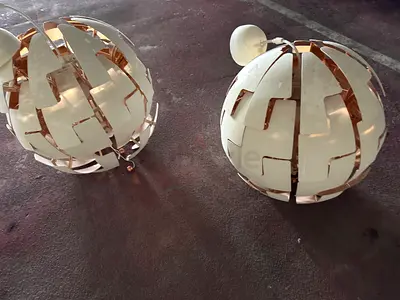 Pair of modern spherical ceiling pendant lights - white & gold