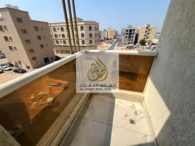 Two-bedroom apartment with a living room, 2 bathrooms, and a balcony, located in Al Aliyah on Moham