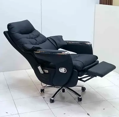 Black reclining office chair with footrest and wheels - good condition