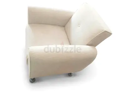 Single beige upholstered armchair in good condition convertible to bed and has storage underneath