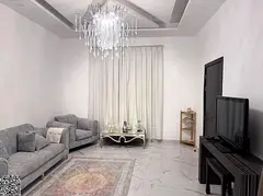 A three-story villa—featuring a modern, contemporary design—