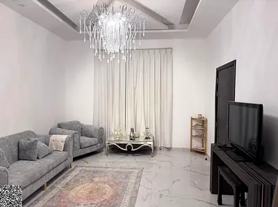 A three-story villa—featuring a modern, contemporary design—