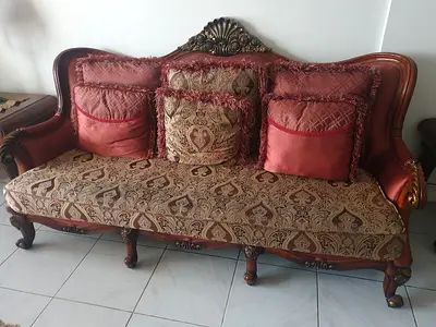 Classic carved wooden 3-seater + 2-seater sofa and a couple of high back chairs in good condition