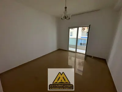 2BR in Nuaimiya 3, balcony, central AC, free parking, near schools and malls. AED 44,000 negotiable.