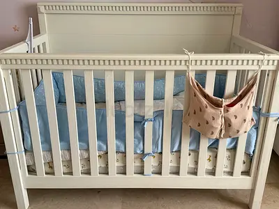 Baby Wooden Crib with Blue Bedding and Mattress
