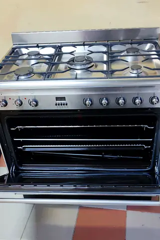 Smeg brand Stainless Steel 5-Burner Gas Range with electric Oven - Good Working Condition