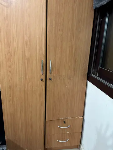 Two-door wooden wardrobe with drawer - good condition