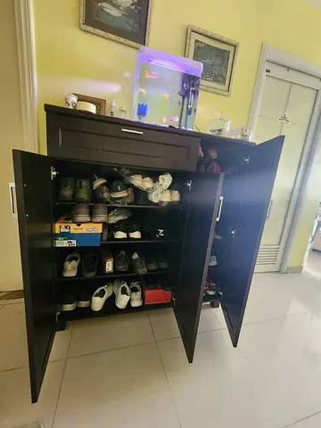 Negotiable.   Dark wood shoe cabinet / storage cupboard - good condition
