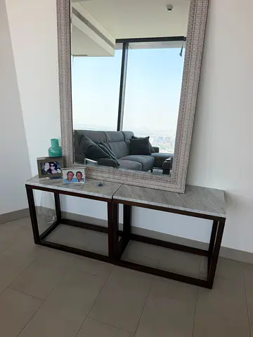 Glass top console table with dark wood frame
