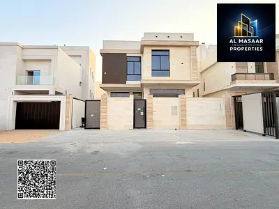 Villa for sale in Al Zahia, Ajman. Includes registration fees. Features 5 master bedrooms, a majlis, a living area, a rooftop, and a maid’s room. Bank