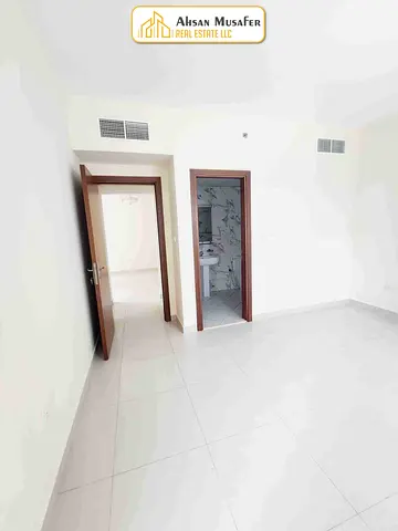 (BRAND NEW BUILDING+ PARKING FREE+10DAYS FREE+WARDROBES ALSO HAVE) EASY EXIT TO DUBAI NEAR RTA BUS STOP LAST UNIT 1BHK WITH 2WASHROOM 6CHQS PAYMENT