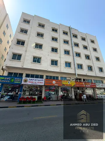 Residential-commercial corner building for sale in Al Rashidiya. Prime location, with a 7% annual yield that has the potential to increase.