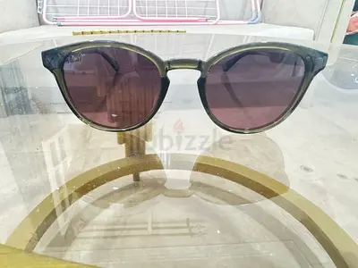 Dark green round-frame sunglasses, gently used , Maui Jim