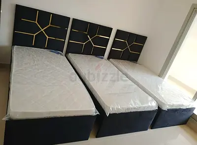 Three single beds with headboards and mattresses - good condition