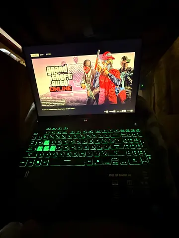 Gaming laptop with green backlit keyboard — working condition