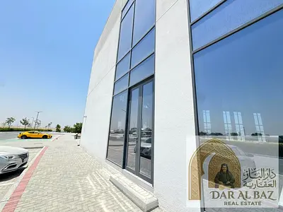 Commercial building for annual rent in Ajmal Makan City, Al Hamriyah, Sharjah. 20,189 sq. ft., 13m high, waterfront, ideal for a clinic or hospital.